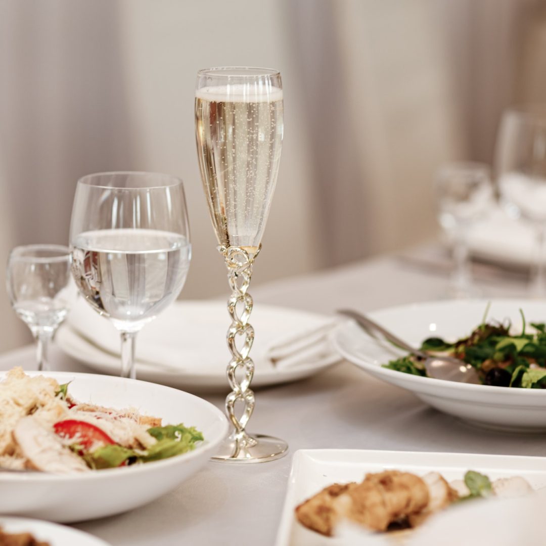 Serving table of a variety of delicious festive food and wine prepared for event party or wedding